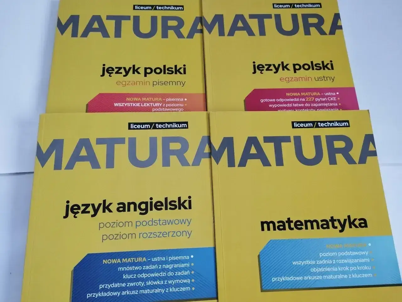 Cztery żółte książki do matury: polski pisemny i ustny, angielski, matematyka.
